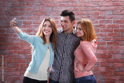 Young people taking selfie ...