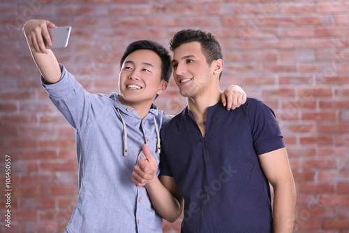 Two young  boys taking self...