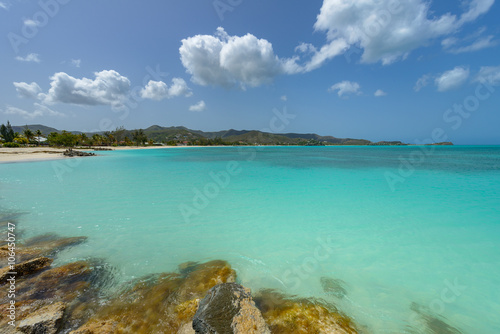 Tropical beach at Antigua island in Caribbean with white sand  t