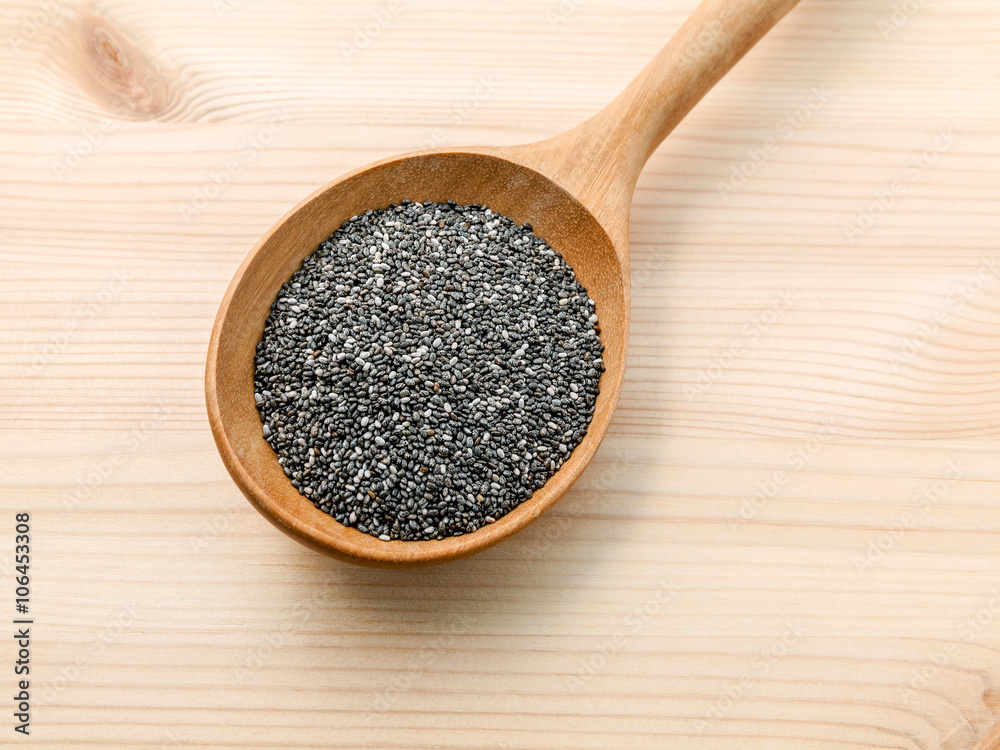 Nutritious chia seeds in wooden spoon for diet food ingredients. Nutritious chia seeds in wooden spoon for diet food ingredients.