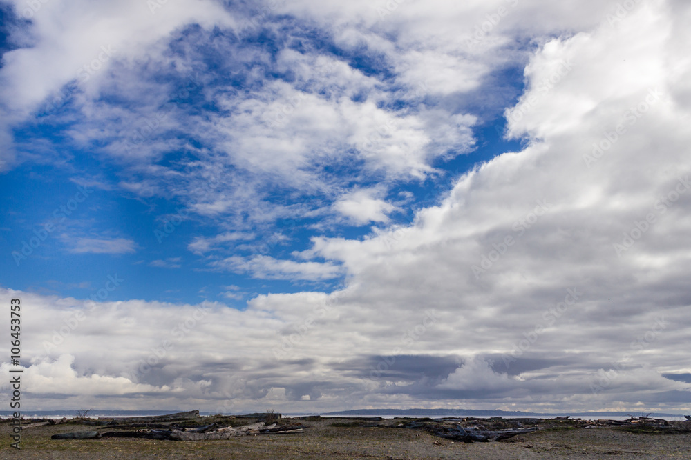 Send beach with blue sky and clouds