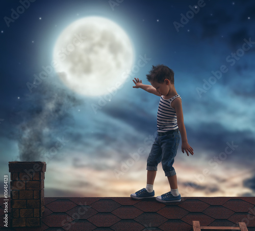 boy walks on the roof