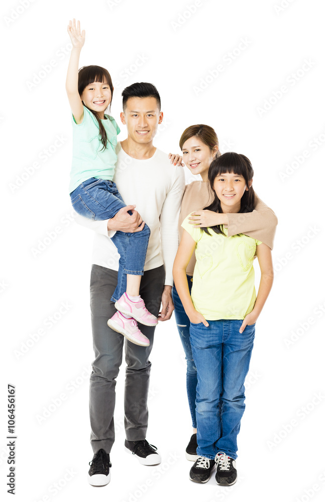 Happy Attractive Young Family standing together Happy Attractive Young Family standing together