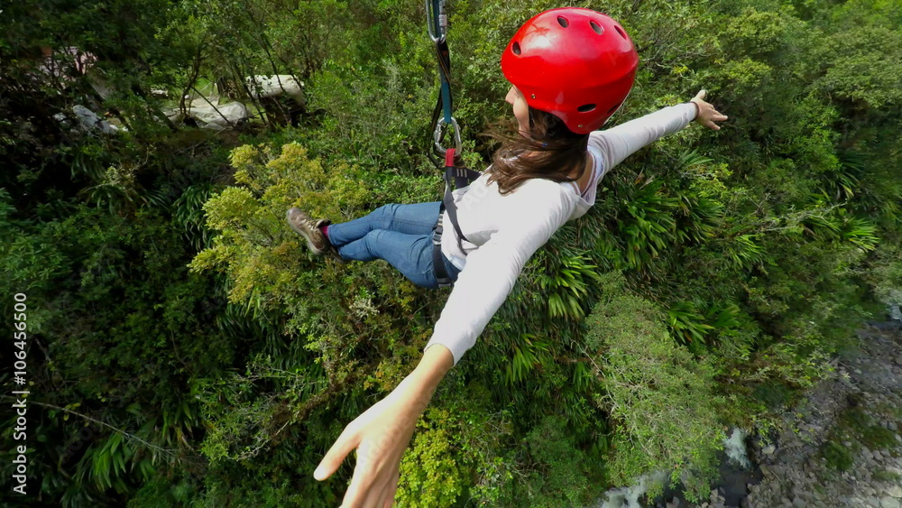 Experience the thrill of beautiful young women sliding on a zipline as the camera gracefully rotates around,capturing every exhilarating moment.