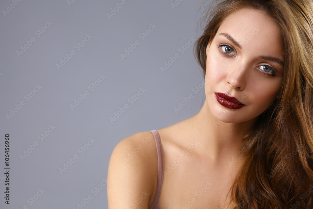 Portrait of beautiful woman , isolated on gray background Portrait of beautiful woman , isolated on gray background