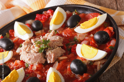 Arabic tuna salad with grilled vegetables and eggs close-up. horizontal
