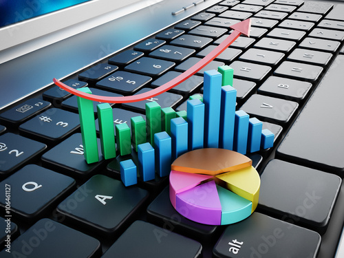 Financial charts standing on laptop computer