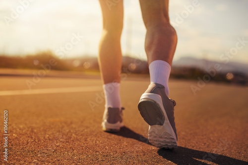 Running sport shoes on runner. Legs and running shoe closeup of