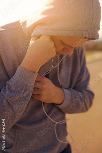 Runner Deep In Thought While Listening To Music
