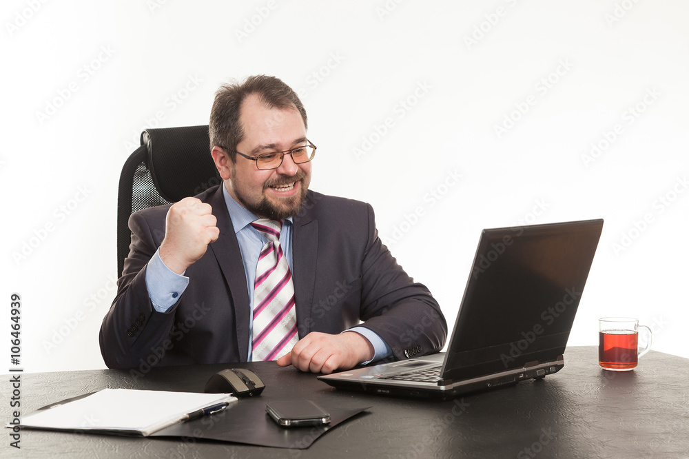 the businessman sits at office table the businessman sits at office table