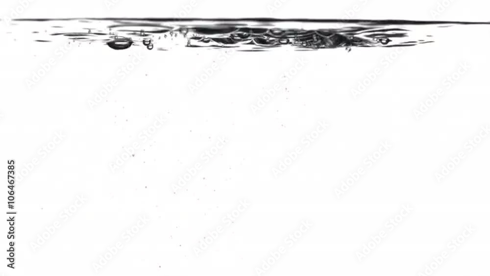 Pouring water splashes and creates bubbles underwater. Locked off with white background, originally recorded in 4K.