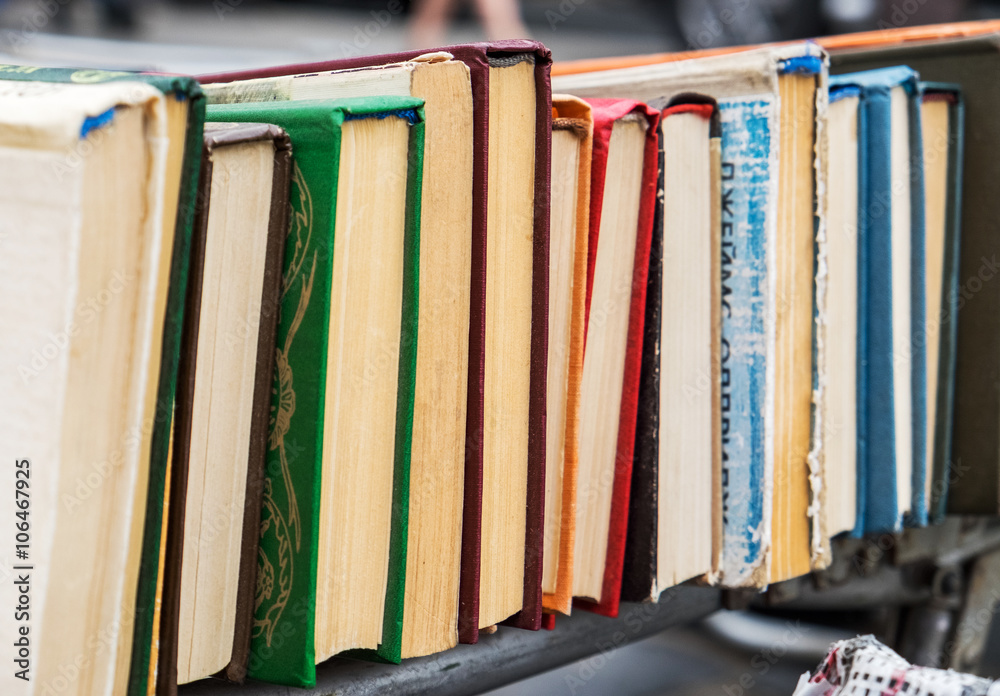 Naklejka premium Many old books in a book shop or library