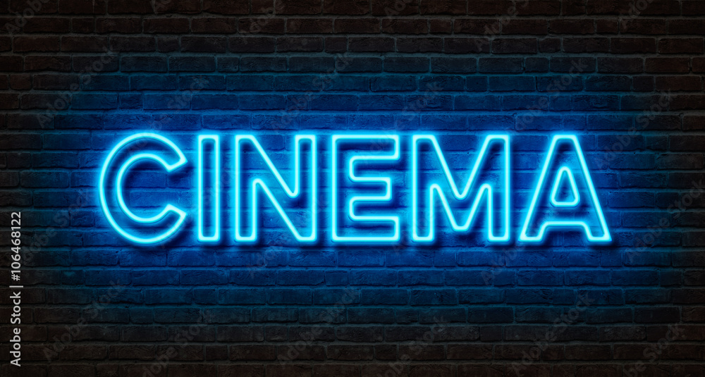 Obraz premium Neon sign on a brick wall - Cinema