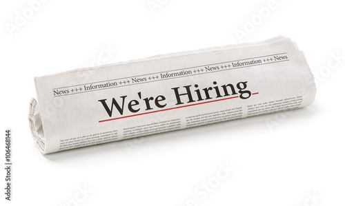Rolled newspaper with the headline We are hiring