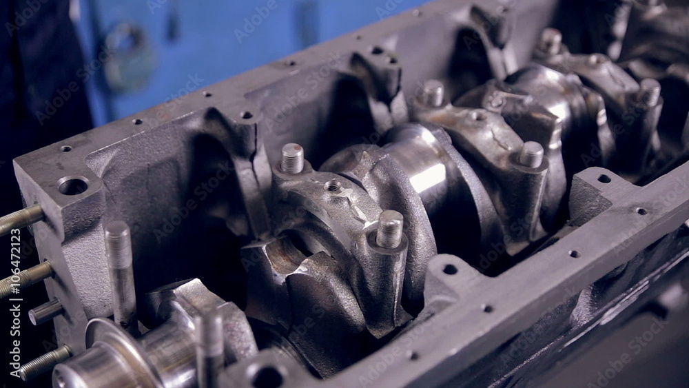 Worker making a car engine on a industrial plant. HD.