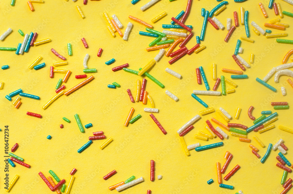 Varicoloured candy on the yellow background Varicoloured candy on the yellow background
