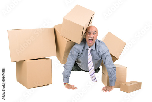 Businessman under boxes