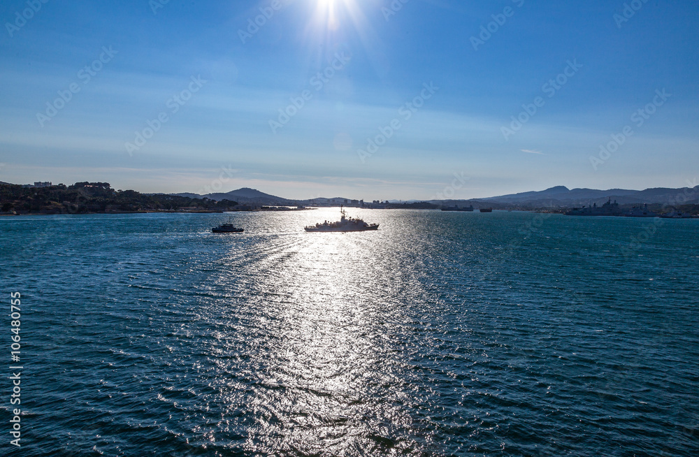 France, the Toulon coast and ships seen from the open sea.