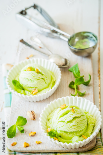 Pistachio ice cream in white bowl
