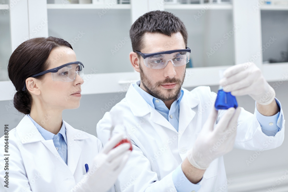 young scientists making test or research in lab young scientists making test or research in lab