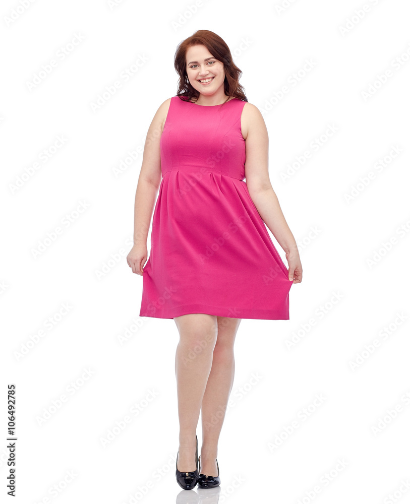 happy young plus size woman posing in pink dress happy young plus size woman posing in pink dress
