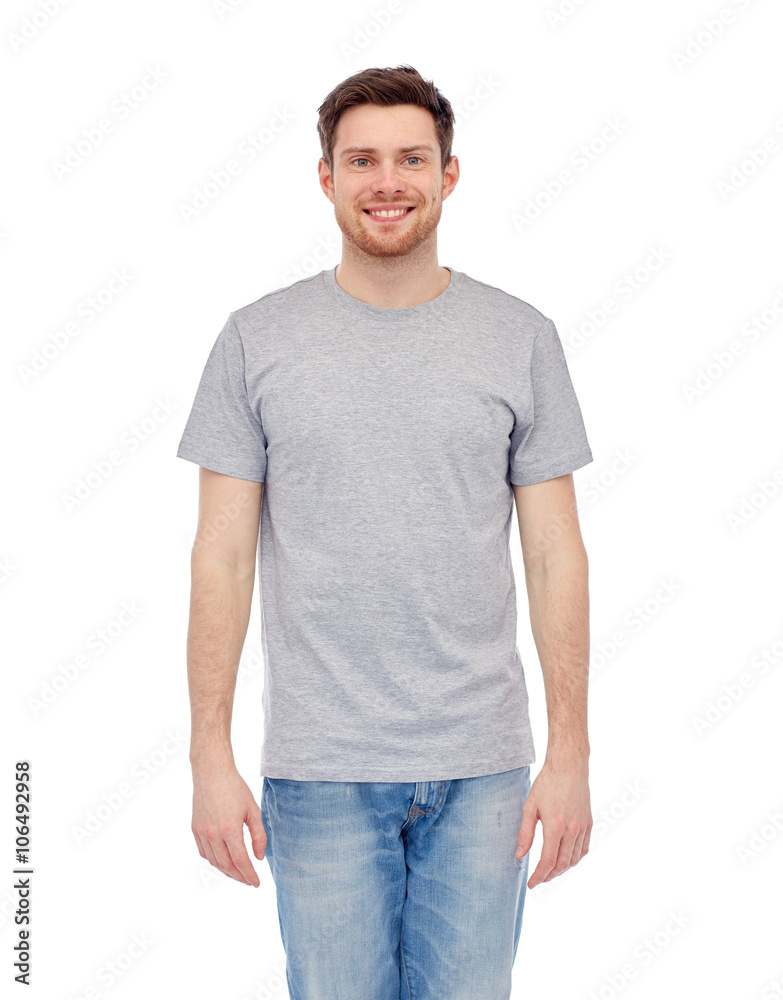 smiling young man in gray t-shirt and jeans smiling young man in gray t-shirt and jeans