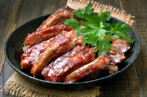 Roasted pork ribs in frying pan
