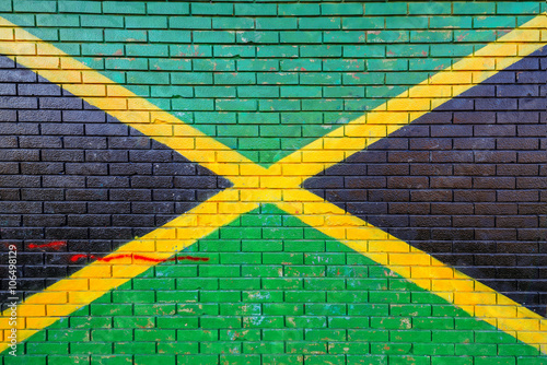 Jamaica flag painted on brick wall