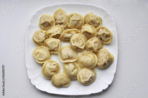 Boiled prepared homemade russian dumplings or pelmeni