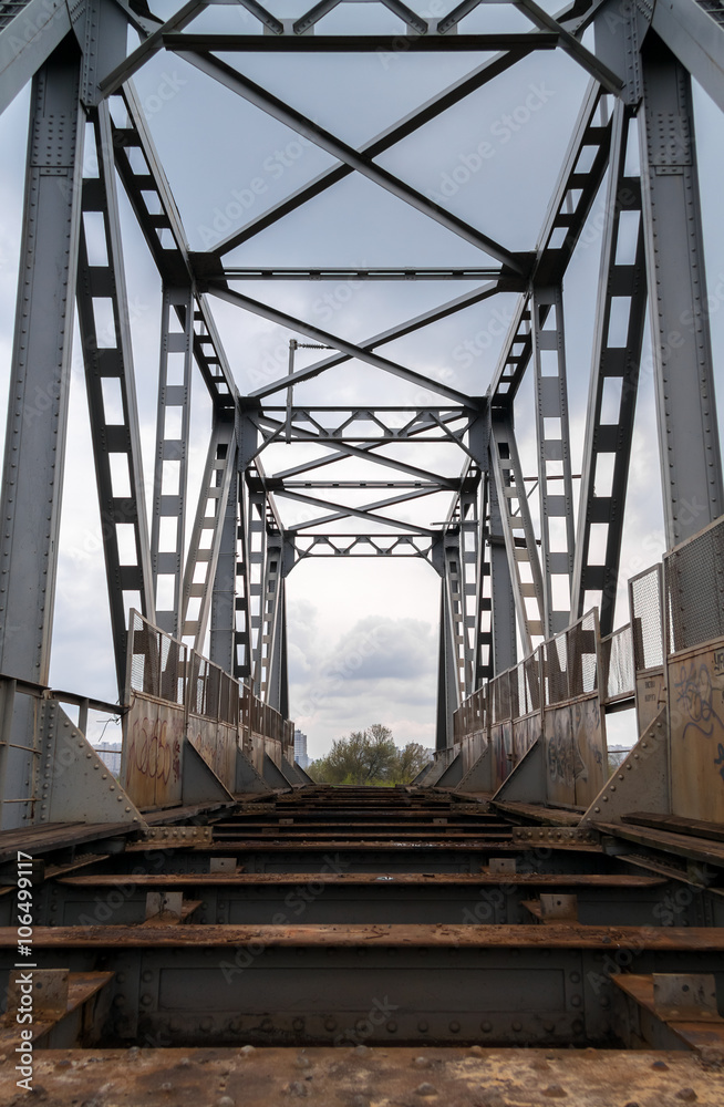 Old abandoned riveted railroad bridge
