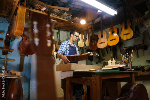 Artisan Lute Maker Storing Guitar Music Instrument In Case