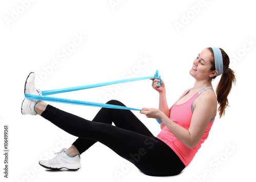 Fit young woman doing workout with physio latex tape. isolated on a white background
