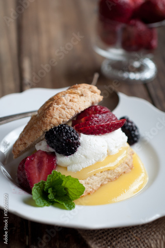 Berry and Lemon Curd Shortcake on Wood Background