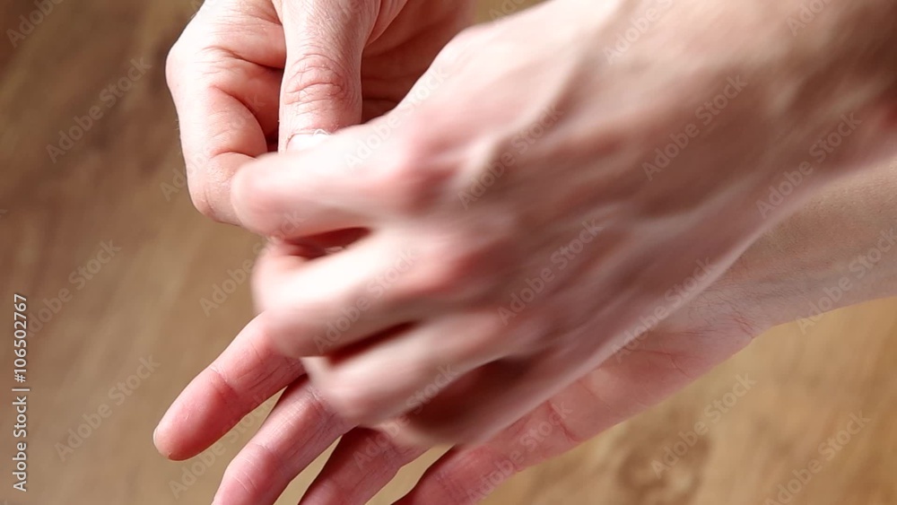 Unwinding the bandage from his hand, part 2
Unwinding the bandage from his hand, part 2