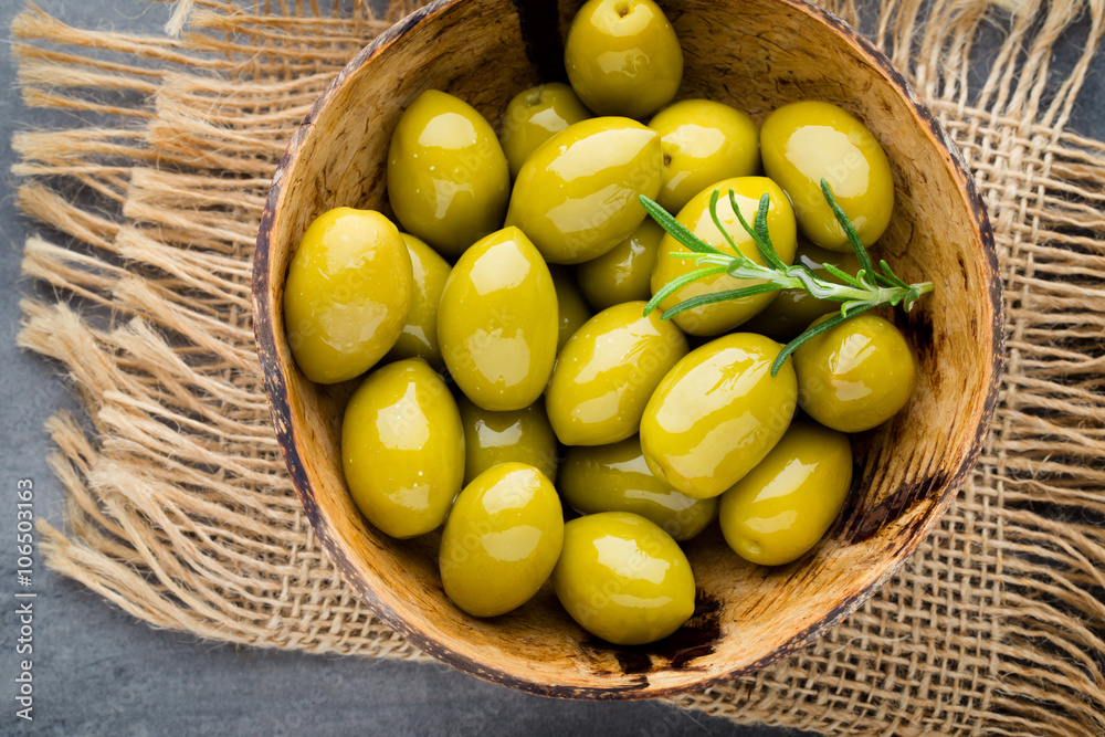 Fresh olives and gray background. Olives in bowl and spoon. Stock Photo ...