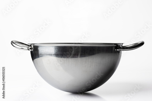 Stainless steel bowl on white background from side