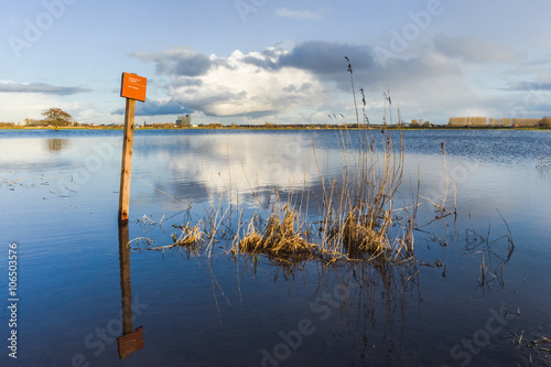 Rising water level in the floodplains of the river IJssel, with photo