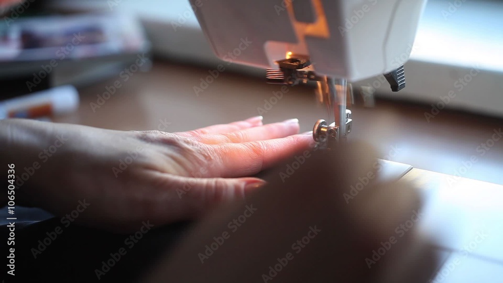 Woman sewing with a sewing machine