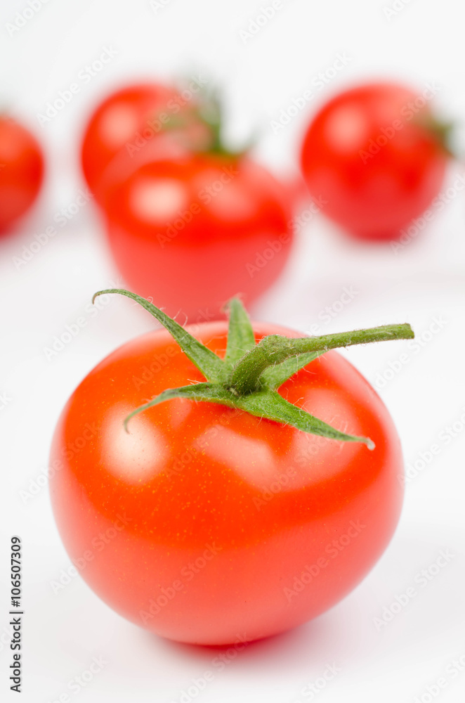 photo of very fresh tomatoes presented on white background photo of very fresh tomatoes presented on white background
