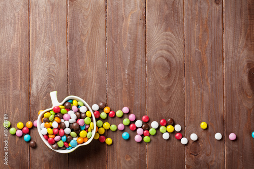 Colorful candies over wood