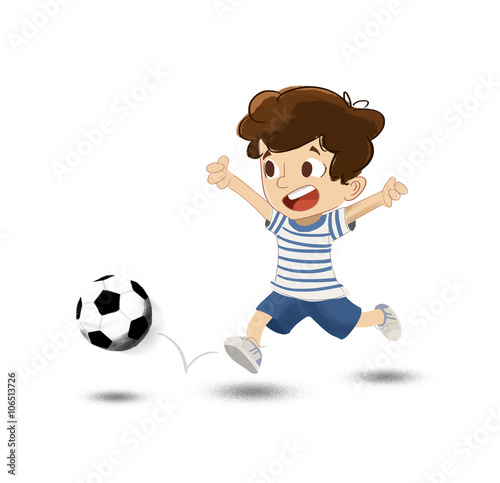 Niño jugando al fútbol en el parque. Corre tras la pelota photo
