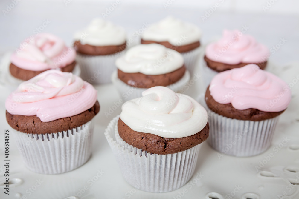 Cupcakes with sour cream frosting on top.