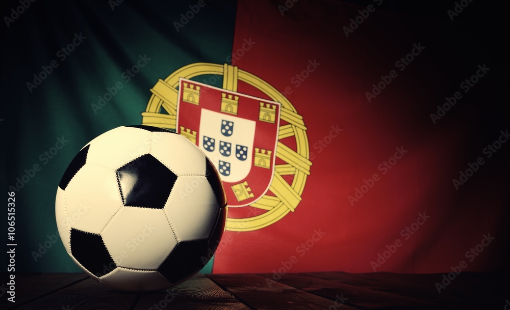 Flag of Portugal with football on wooden boards as the background. Vintage Style.