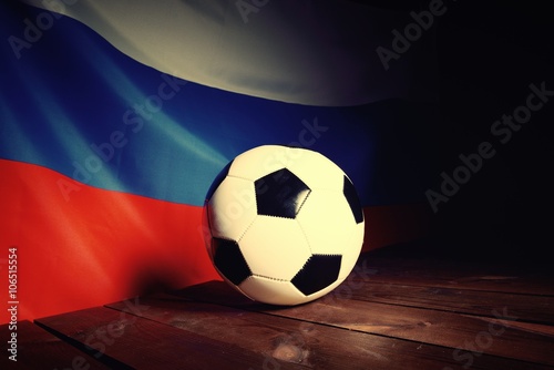 Flag of Russia with football on wooden boards as the background. Vintage Style.