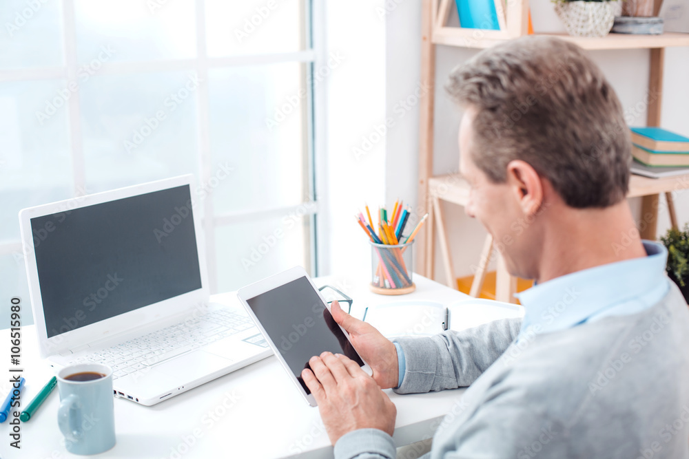Adult businessman while working day Adult businessman while working day