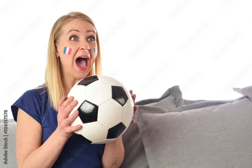 French soccer fan cheers football team in the national colors.