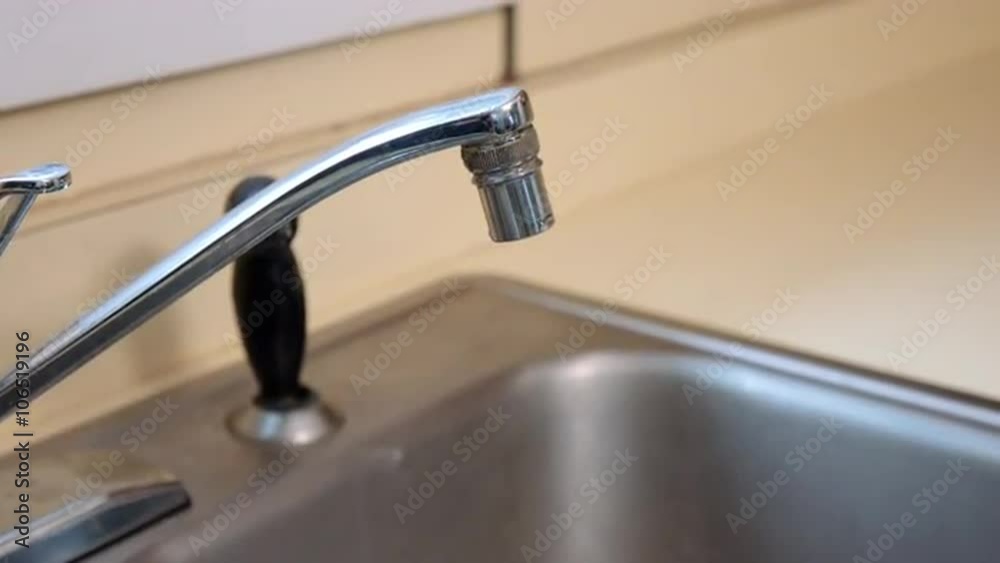 move in to an old kitchen sink and dripping faucet. Has limescale and calcium deposits around the spout move in to an old kitchen sink and dripping faucet. Has limescale and calcium deposits around the spout