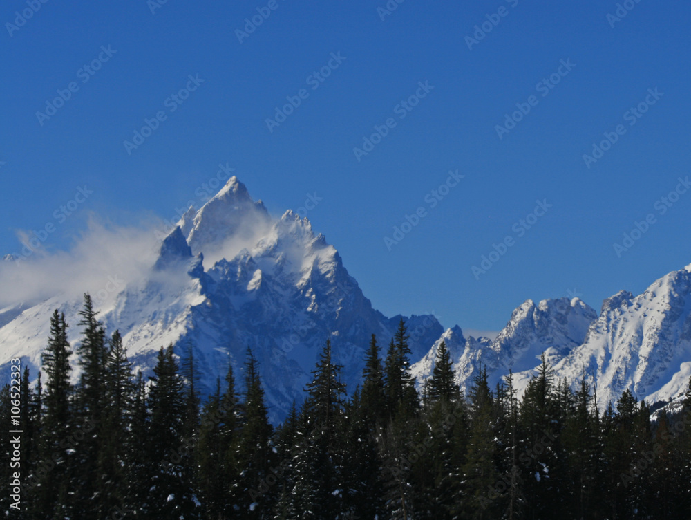Grand Teton National Park peak with mist blowing off in Wyoming United States Grand Teton National Park peak with mist blowing off in Wyoming United States