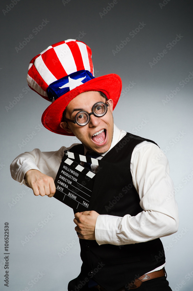 Man with american hat and movie board Man with american hat and movie board