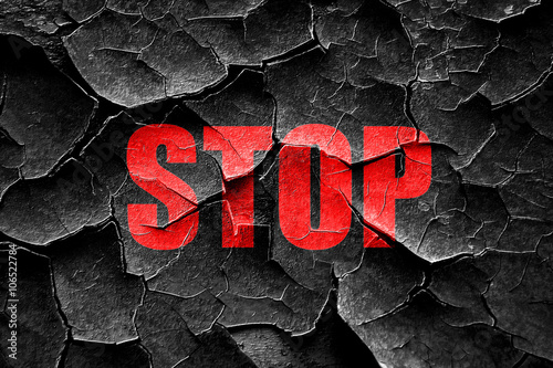 Grunge cracked stop sign background photo